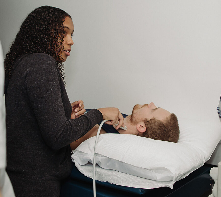 a health student performing a test on a patient